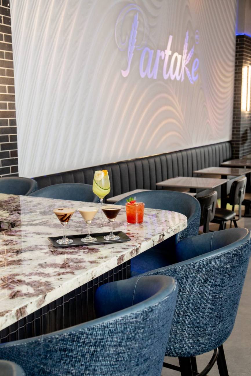 A birthday table set with cocktails at Partake NYC